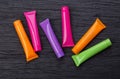 Four bright multi-colored 3D moÃÂkup tubes Royalty Free Stock Photo